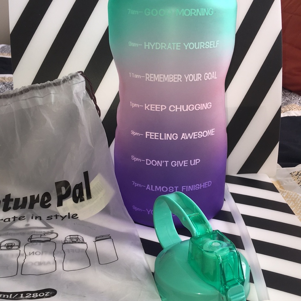 Venture Pal multi colored. 128oz. Screw on lid. Straw included. Never used.